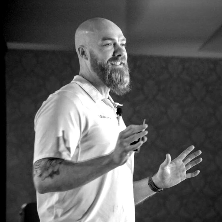 Nick Mann speaking to a group